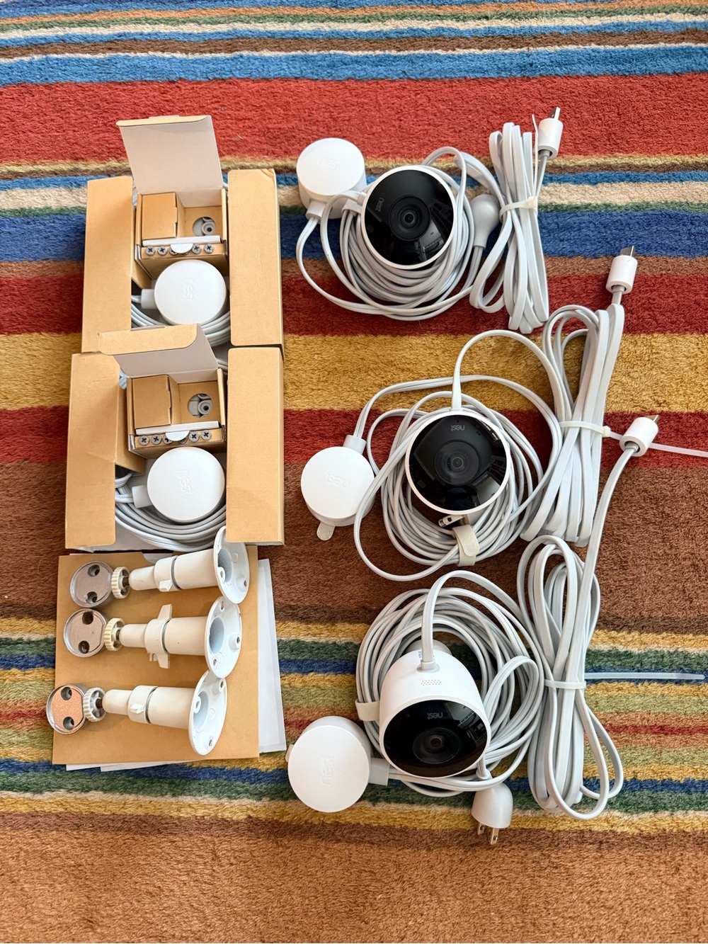 Google Nest Outdoor Security Cameras with White Cables and aftermarket mounts